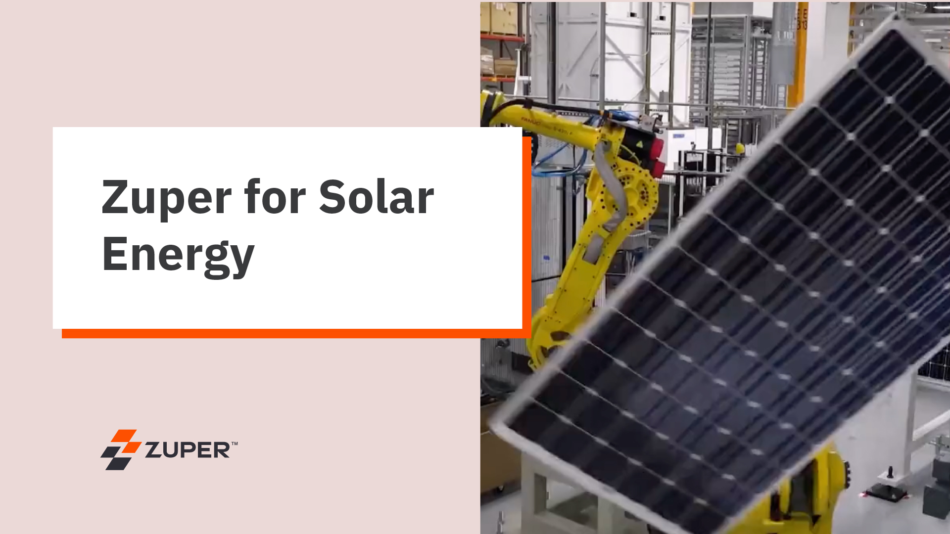 Yellow robotic arm positioning a solar panel in a manufacturing facility
