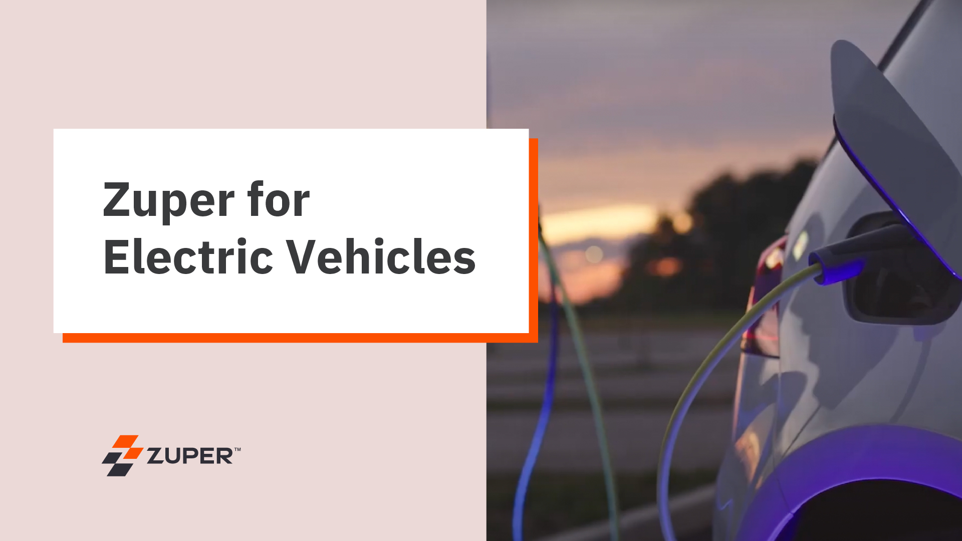 Electric vehicle charging port with cable connected at sunset