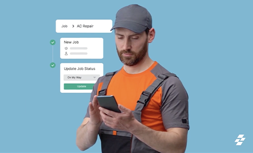 Technician in work gear using mobile app to update AC repair job status in the field