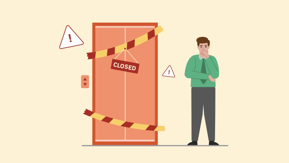 Concerned office worker facing closed elevator with caution tape and warning signs