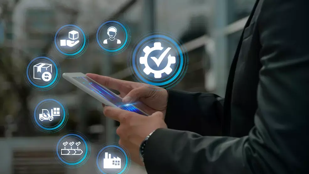 Business professional using tablet with supply chain management icons including delivery, customer service, quality assurance, and logistics