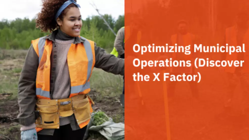 Municipal worker in orange safety vest and tool belt smiling during outdoor fieldwork project