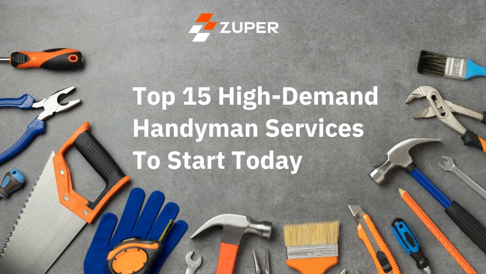 Assorted hand tools including hammer, saw, pliers, and paintbrush arranged on gray surface for handyman services