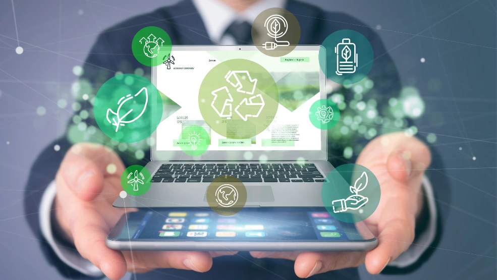 Laptop displaying eco-friendly business website with recycling icons and sustainability symbols floating around screen
