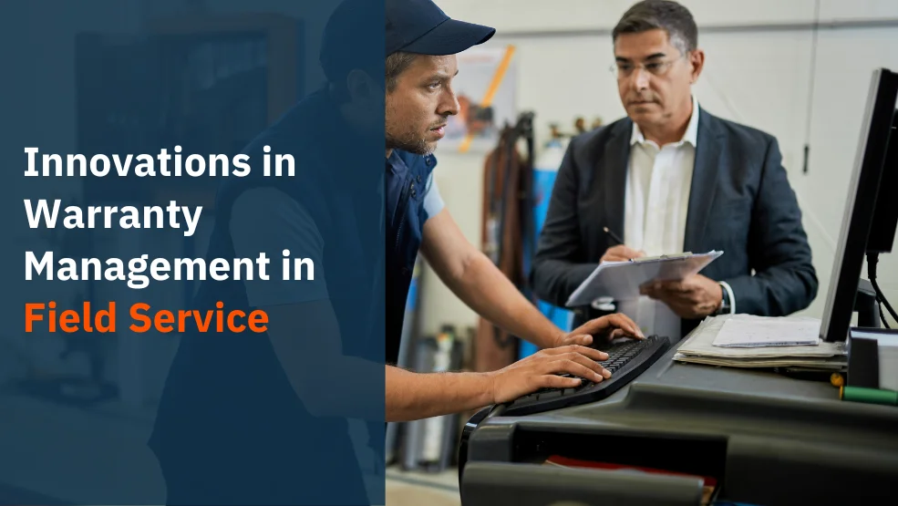 Field service technician at computer workstation discussing warranty documentation with manager holding clipboard