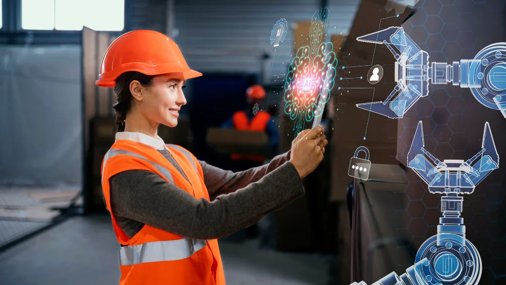 Woman in hard hat and safety vest interacting with AI-powered robotic arm interface in industrial facility