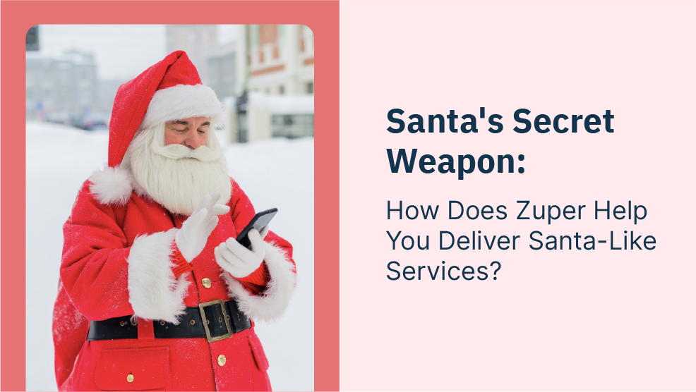 Santa Claus in red suit checking smartphone outdoors in winter snow