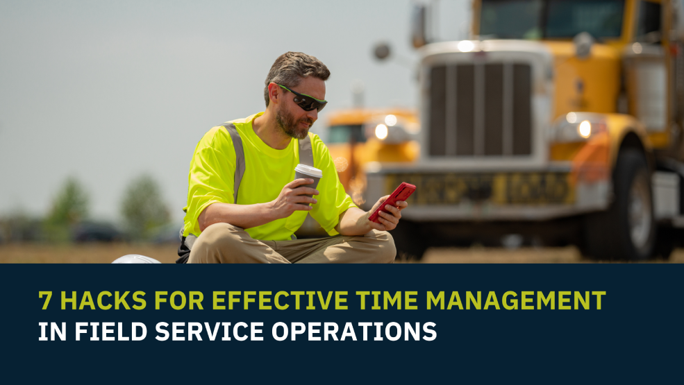 Field service technician in safety vest checking smartphone while on break near commercial truck