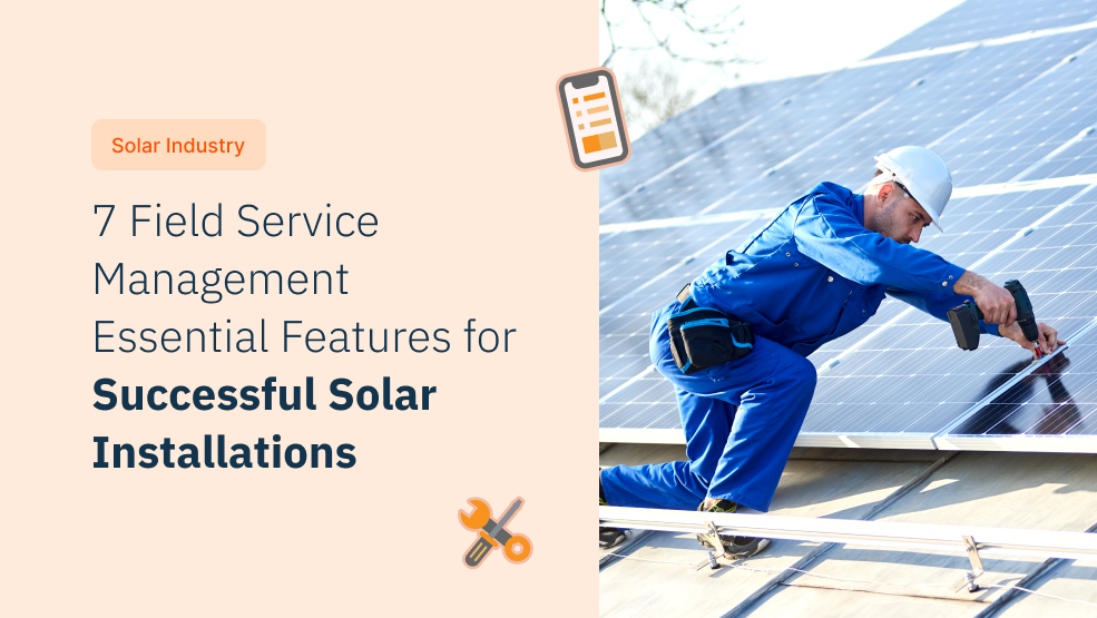 Solar technician in blue coveralls and hard hat installing rooftop solar panels with field service management app overlay
