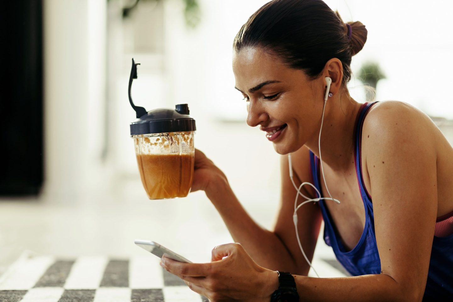 woman drinking fruit smoothie